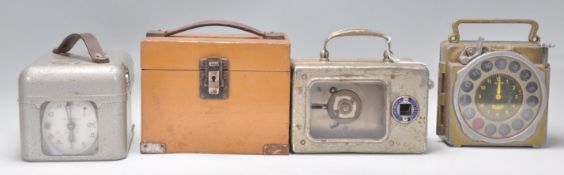 A group of four vintage 20th Century Pigeon clocks to include a Natural Antwerp Junior metal cased