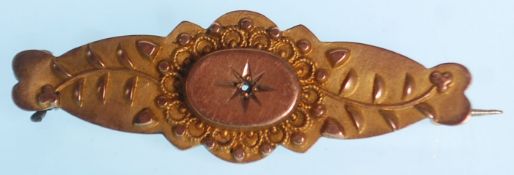 A 19th Century Victorian brooch having repousse floate decoration. Later added pin to verso. Total