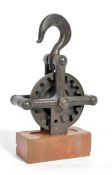 ORIGINAL 1950'S STEEL SCULPTURE PULLEY AND WHEEL ON BRISTOL BRICK