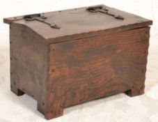 A 20th century antique revival elm coffer of small