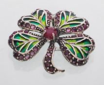 A  sterling silver plique a jour four leaf clover