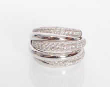 A 18ct white gold crossover ring having alternate
