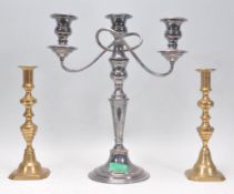 A pair of antique brass candlesticks having knoppe