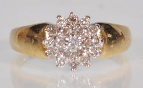 An 18ct yellow gold ladies diamond cluster ring ha