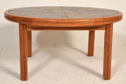 A retro mid century Danish teak wood and tile top