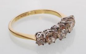 An 18ct yellow gold five stone diamond ring set wi