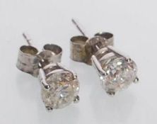 A pair of white gold & diamond stud earrings set w