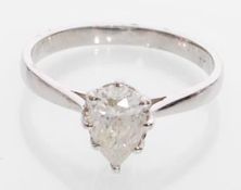 An 18ct white gold solitaire ring set with a teard