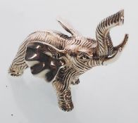 A cast sterling silver figure of an elephant trump
