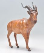 An unusual 20th century leather figurine of an Afr