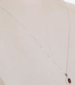An 18ct white gold pendant pendant necklace having
