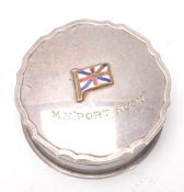 A silver hallmarked lidded pot with enamel flag an