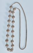 A 20th Century silver necklace having spaced filig