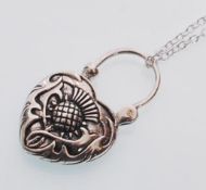 An sterling silver heart shaped pendant necklace i