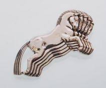 A sterling silver brooch of a five horses jumping.