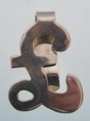 A sterling silver money clip in the form of a poun