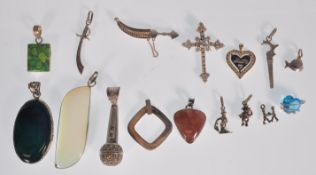A selection of silver pendant and charms to includ