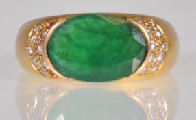 An 18ct gold ladies dress ring set with an oval cu