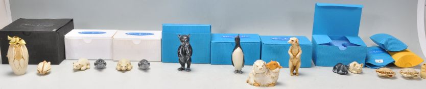 A collection of Adam Binder netsuke style animal figurines to include two polar bears, two penguins,