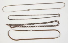 A group of four silver necklaces to include mostly flat link examples. Two having lobster clasps and