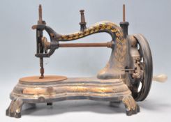 A 19th Century Victorian Jones Empress of India cat back sewing machine of serpentine form, raised