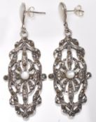 A pair of stamped 925 silver ladies drop earrings  having pierced decoration set with marcasites and