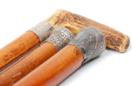 A group of three 19th Century antique Malacca walking stick canes to include a horn handles