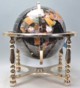 A vintage 20th century large terrestrial globe having semi precious stone inlay. Black stone
