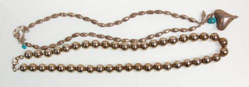 Two silver necklaces to include a Tiffany style ball example having a lobster clasp. Stamped 925.