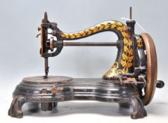 A vintage early 20th Century cast iron sewing machine by Jones 'The Lightning Hand Machine' having