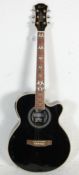 A good Lindo 'Black Fire' model acoustic and electric six string guitar having a black body with