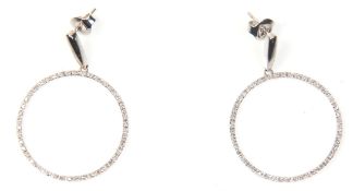 A pair of 14ct white gold drop hoop earrings being set with round cut diamonds. Weight 4.2g. Measure