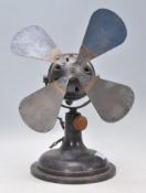 A late Victorian / early 20th Century industrial black metal desk fan by S . Universal 2201505.