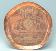 A good early 20th Century Arts & Crafts copper hammered tray of heptagonal form having central