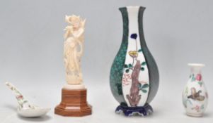 A collection of Chinese ceramics to include a waisted vase having alternate panelled sides being