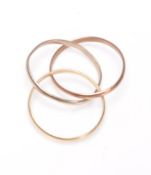 A 9ct gold hallmarked tri-colour puzzle ring. Hallmarked. Total weight 1.8g / Size I.5.