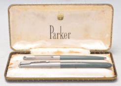 A vintage set of Parker writing pens complete in their original box to include one writing ink pen