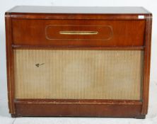 A 1940's walnut veneered cased floor standing Regentone record player radiogram raised on a plinth