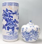 A large blue and white contemporary Chinese pumpkin shaped ginger jar decorated with peony trees etc
