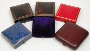 A good group of six vintage jewellery boxes mostly leather with gilt tooled decoration, a blue