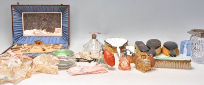 A mixed group of vintage ladies dressing table pieces and accessories to include two white and black