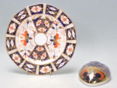 A Royal Crown Derby paperweight in the form of a mouse painted in blue and red with gilt
