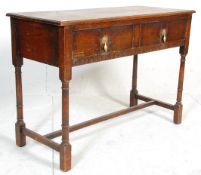 An 18th century revival Jacobean writing table desk. Raised on turned legs united by stretchers