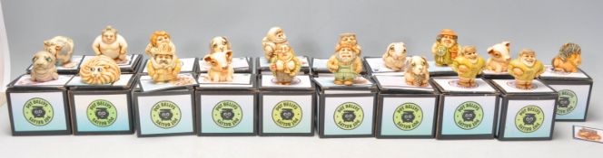 A good collection nineteen Pot Bellys carved resin figures to include Fireman, Pig, Dog, Cow,