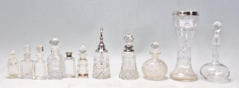 A collection of antique and vintage cut glass perfume / scent bottles to include a 1920's Art Deco