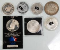 A group of seven silver American coins to include fine silver USA Eagles Veterans Day coin, 1 oz