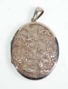 A 19th Century Victorian unmarked silver locket having finely carved Japanese scene panel front.