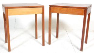 A pair of 1960's Air Ministry type solid teak wood side / lamp tables. Each raised on square