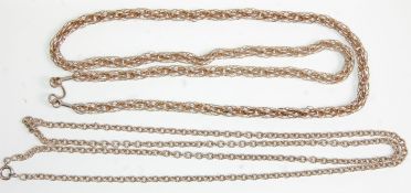 Two silver necklace chains to include a rope link example having a double hook clasp. The other