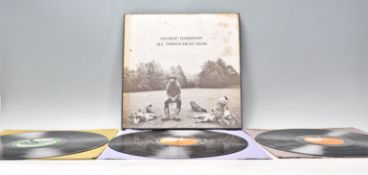 A three vinyl long play LP record album box set by George Harrison – All Things Must Pass – Original